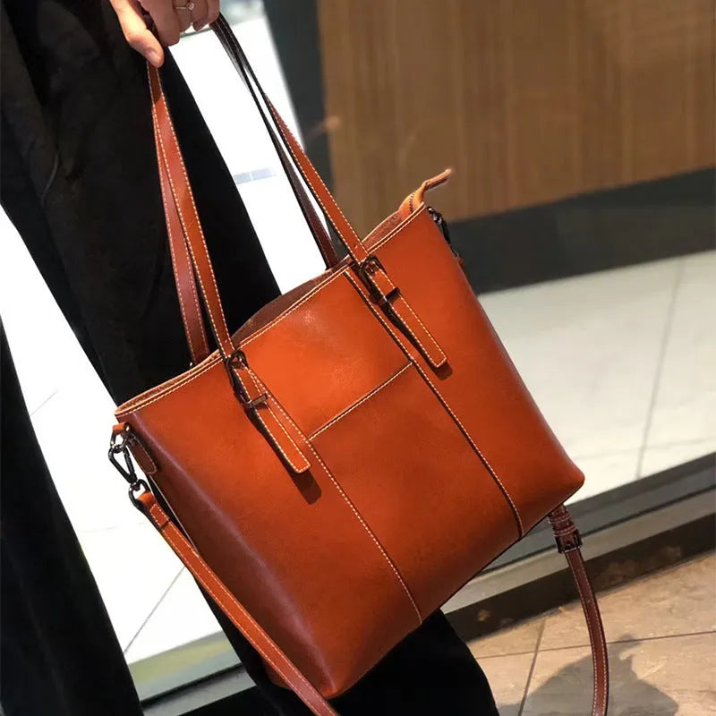 Genuine leather women's retro shoulder bag in brown with multiple compartments and straps