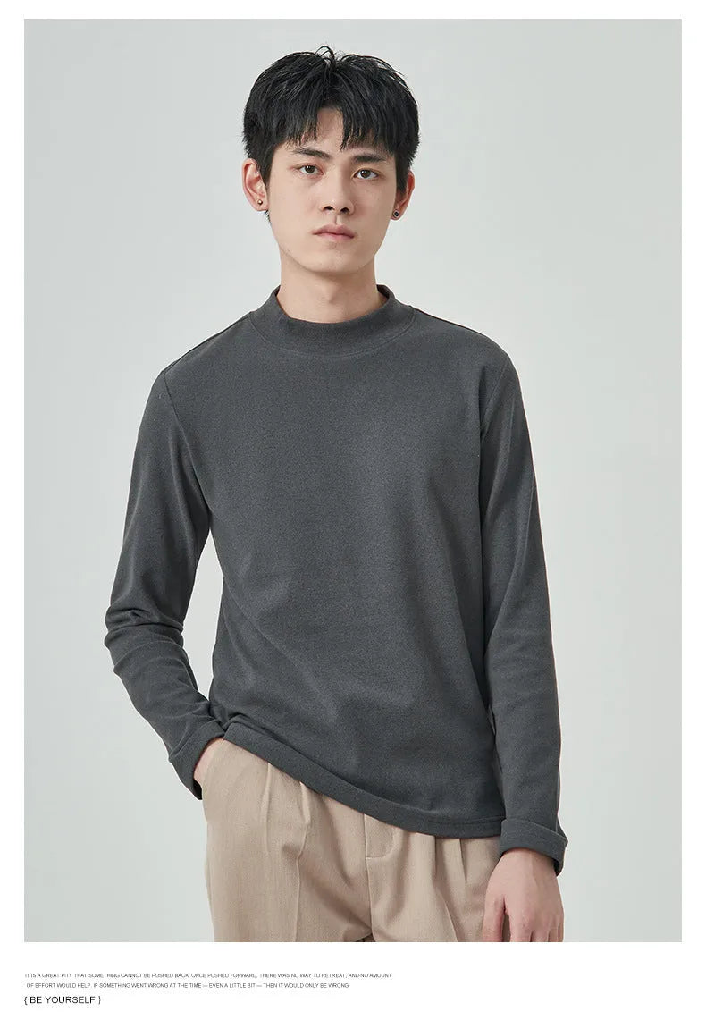 Man wearing a beige half-high collar long-sleeved T-shirt for casual autumn winter wear