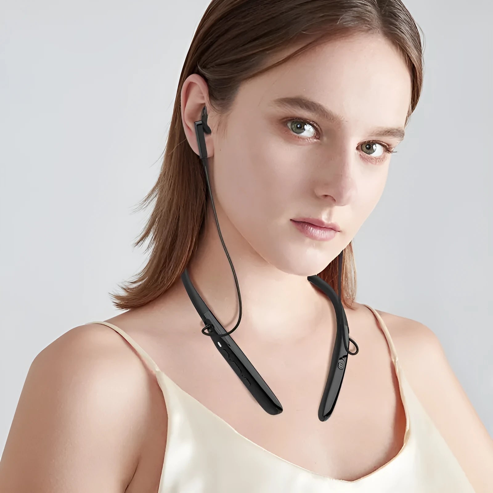 Black Bluetooth digital hearing aid with neck strap, USB port, and ABS plastic body on a white background