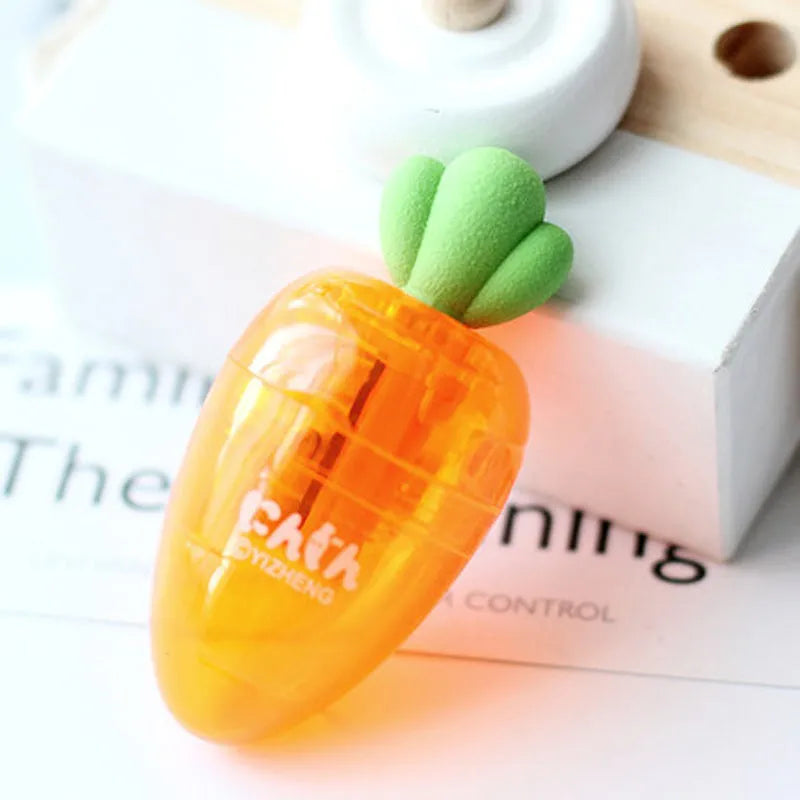Carrot-shaped plastic manual pencil sharpener with extended handle on a white background.
