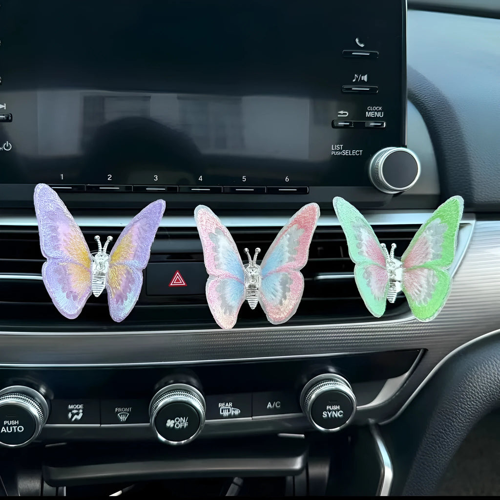 Fabric embroidery butterfly decoration for car air vent in multiple colour options.