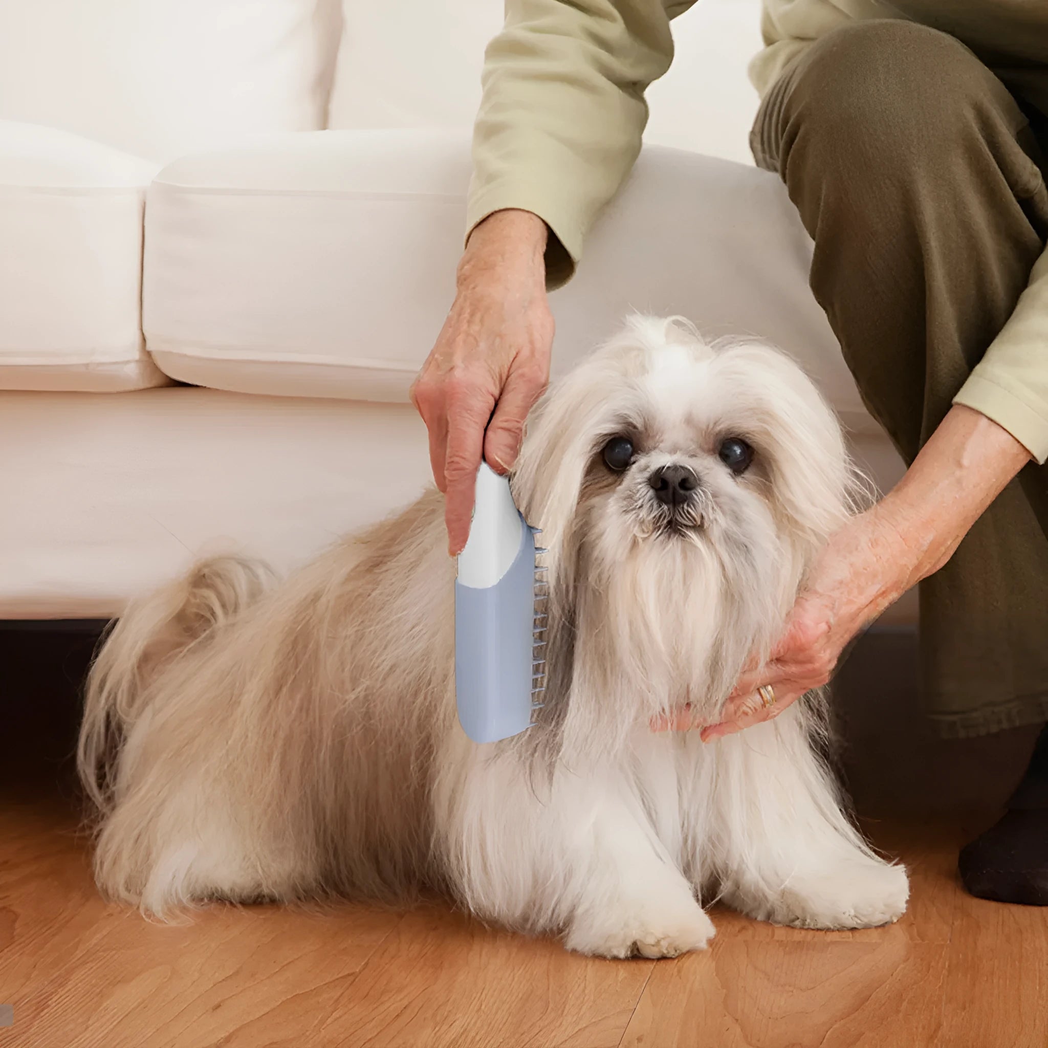 Blue ABS pet grooming comb with removable silicone massage head and ozone sterilisation function