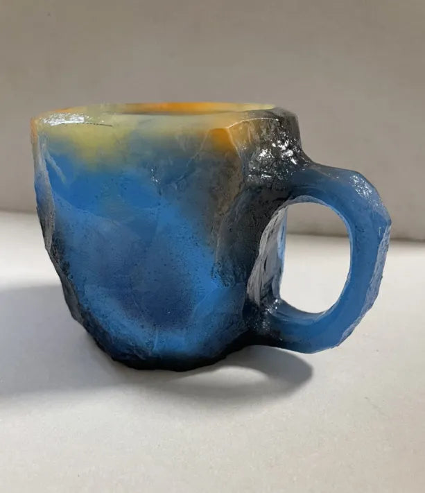 Purple resin mineral crystal coffee mug with handle showing 3D texture and 10cm height