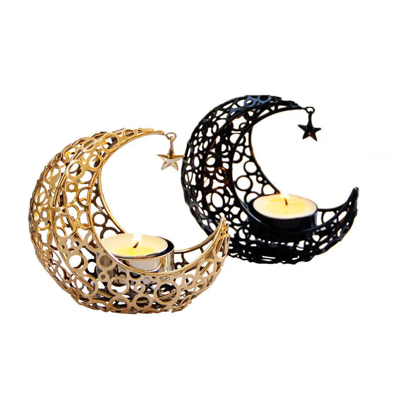 Gold crescent moon metal candle holder with hollow pattern on a wooden table
