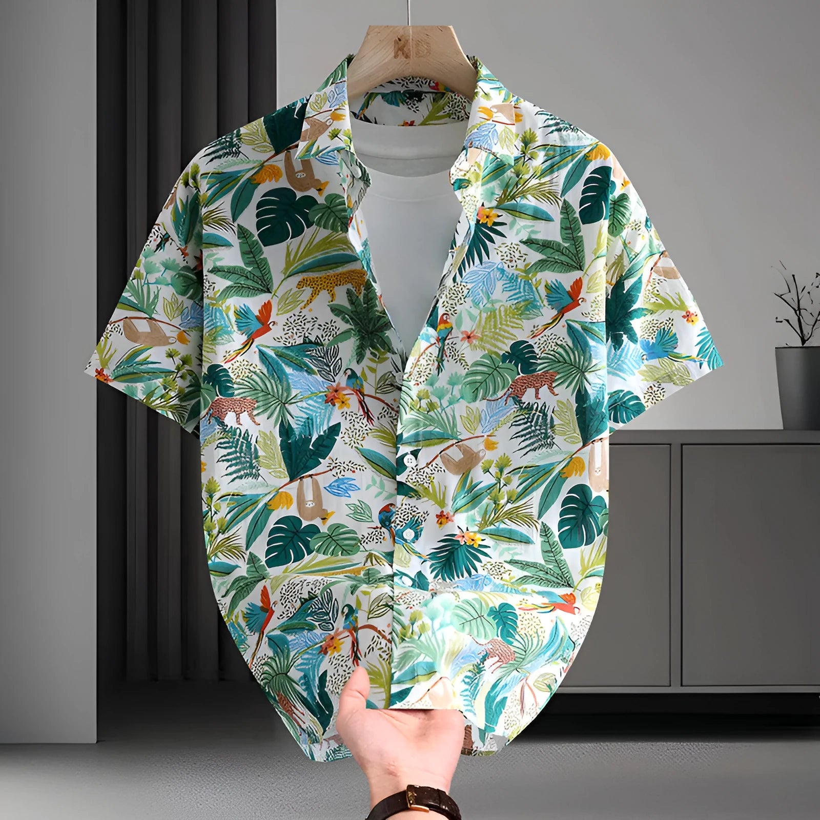 Man wearing a short sleeve Hawaiian style casual shirt with a floral printed pattern.
