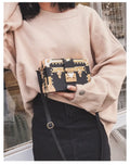 Hard PU leather women's shoulder bag with flap design and crossbody strap in black or green