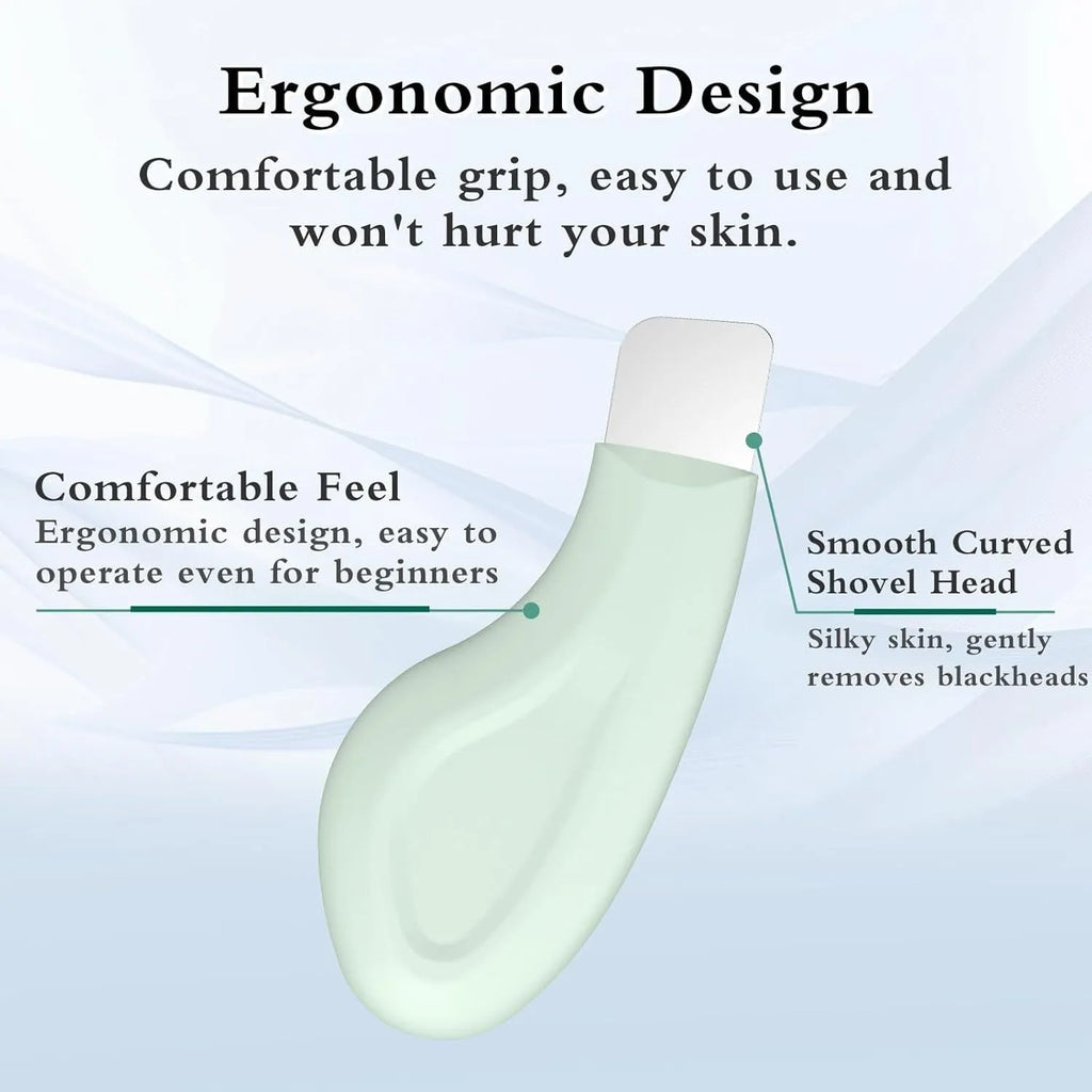 A stainless steel blackhead remover tool with a non-slip handle on a flat surface.