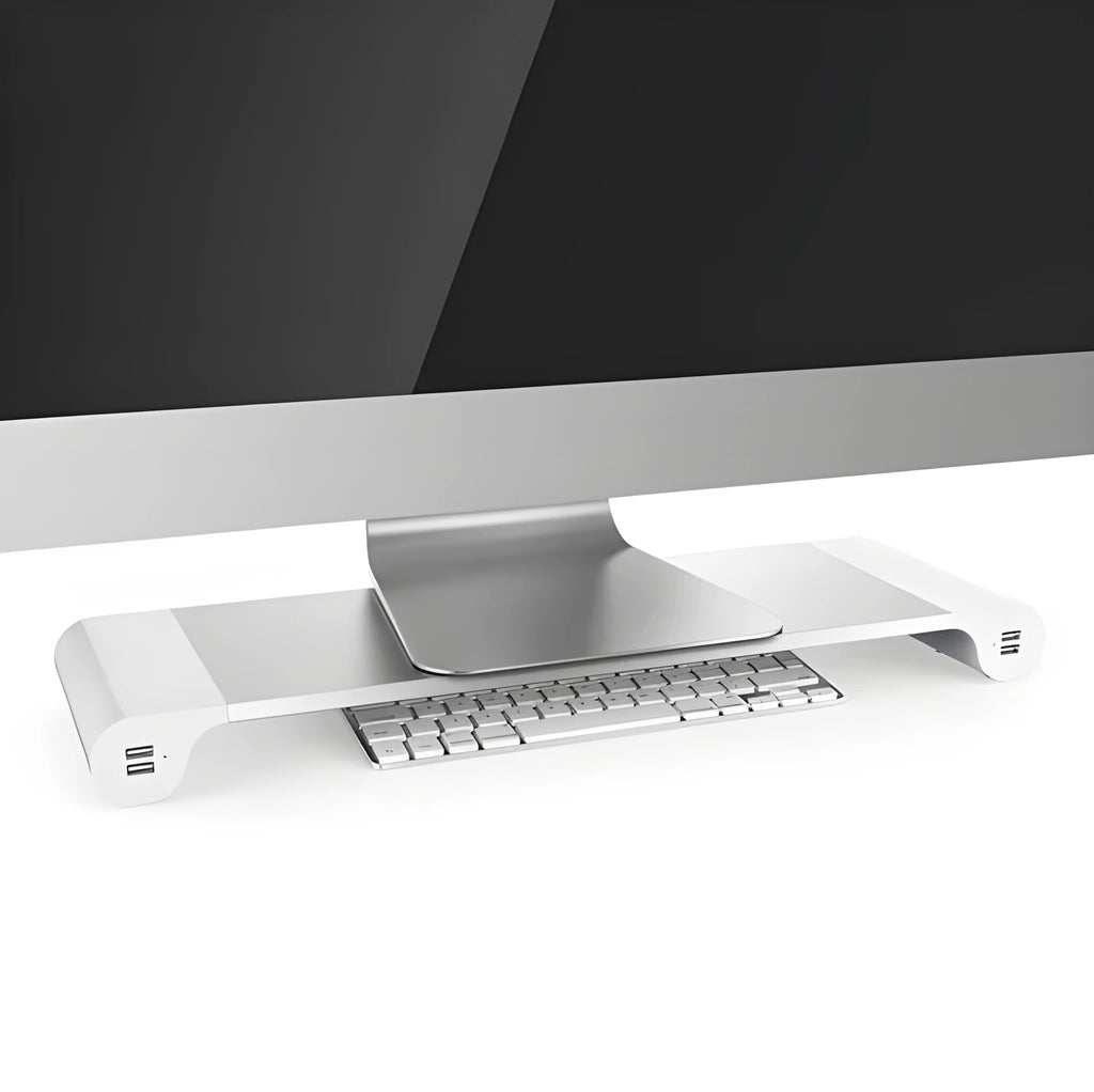 Silver and black computer monitor stand with USB charging ports and hidden keyboard storage compartment