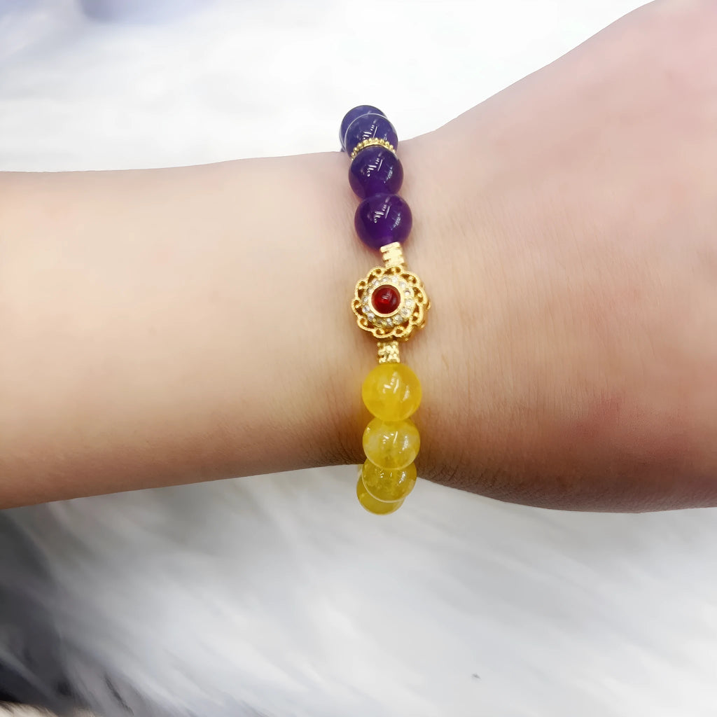 Handmade women's yellow and purple bracelet with amethyst and crystal beads featuring adjustable sliding knot closure