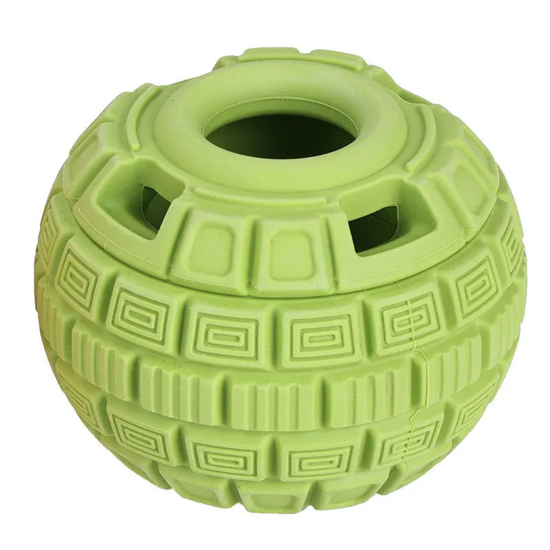 Green and orange natural rubber hollow ball dog toy for slow feeding and chewing.
