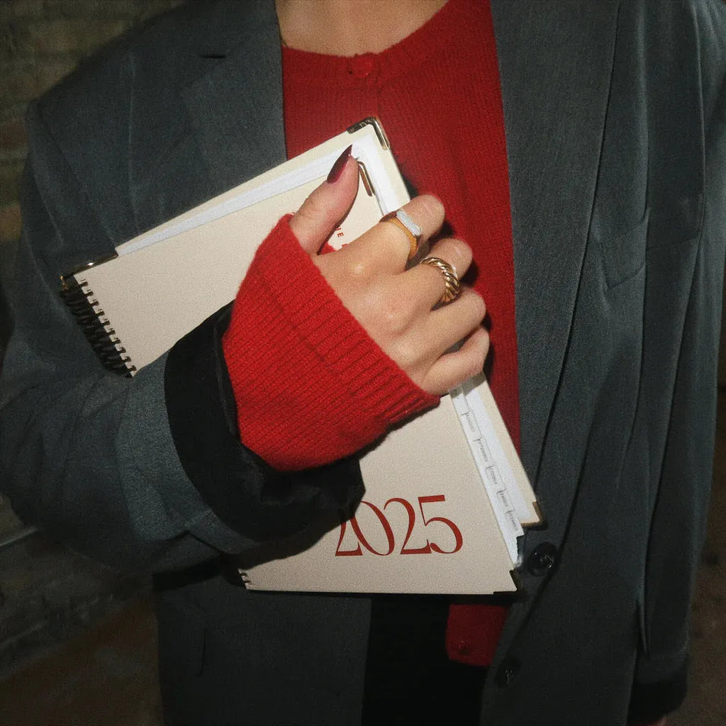Cherry red A4 daily schedule coil notebook with hardback cover showing coil binding