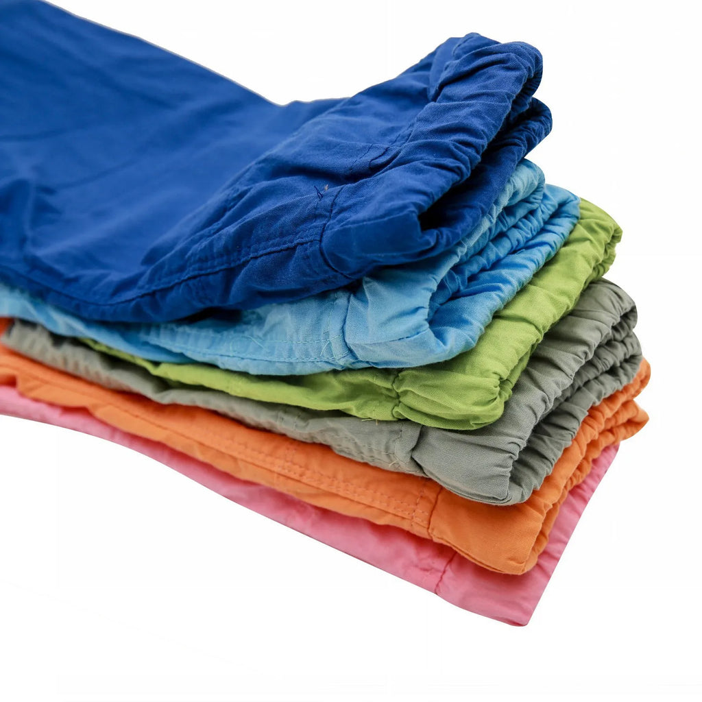 Orange cotton and linen cropped trousers for children with elastic waistband