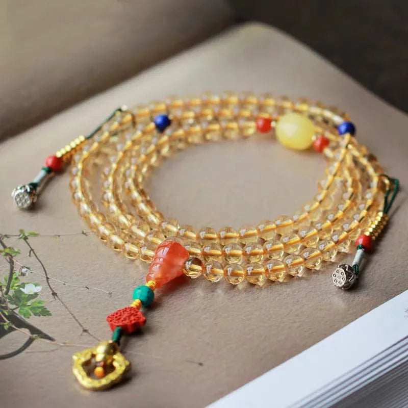 Brazilian citrine bracelet with red and yellow colours on adjustable filament cord