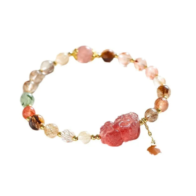 Women's strawberry quartz crystal bracelet with copper construction and pearl detailing in Chinese style design.