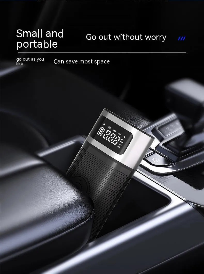 Black portable wireless smart vehicle air pump with USB cable and multiple inflation nozzles on a grey background.