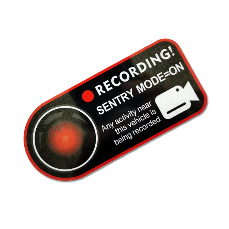 Pair of white rectangular Tesla Sentry Mode warning stickers with black text, 11cm by 5cm.