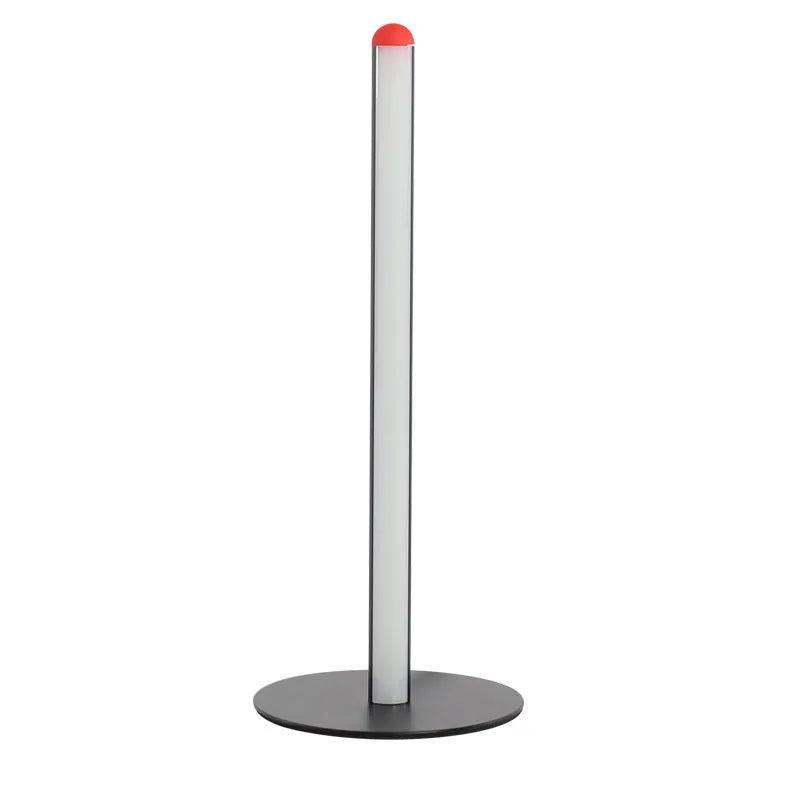 Modern vertical aluminium alloy floor lamp in silver, shown beside a sofa in a living room setting.