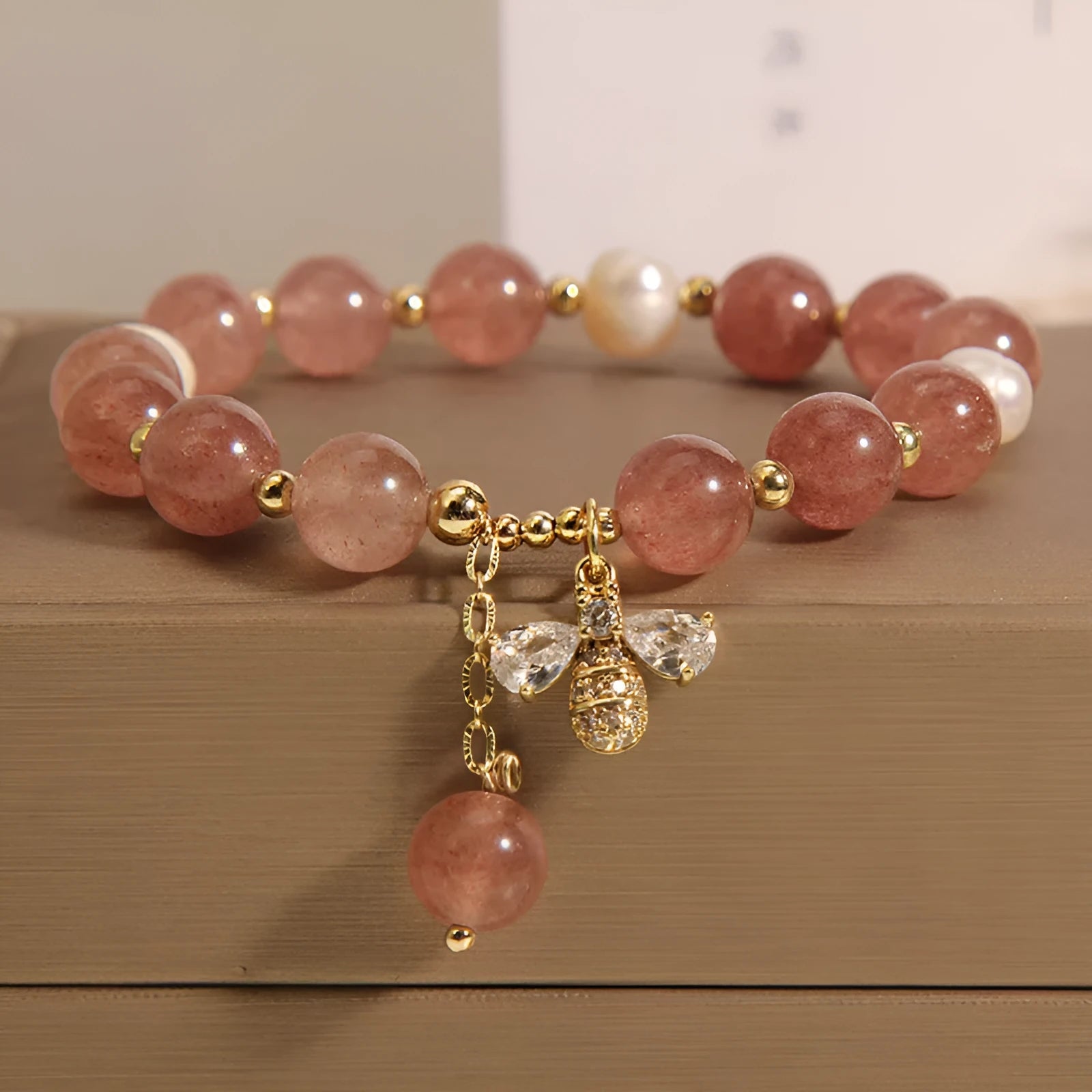 Women's strawberry quartz and freshwater pearl bracelet with zircon details in alloy setting