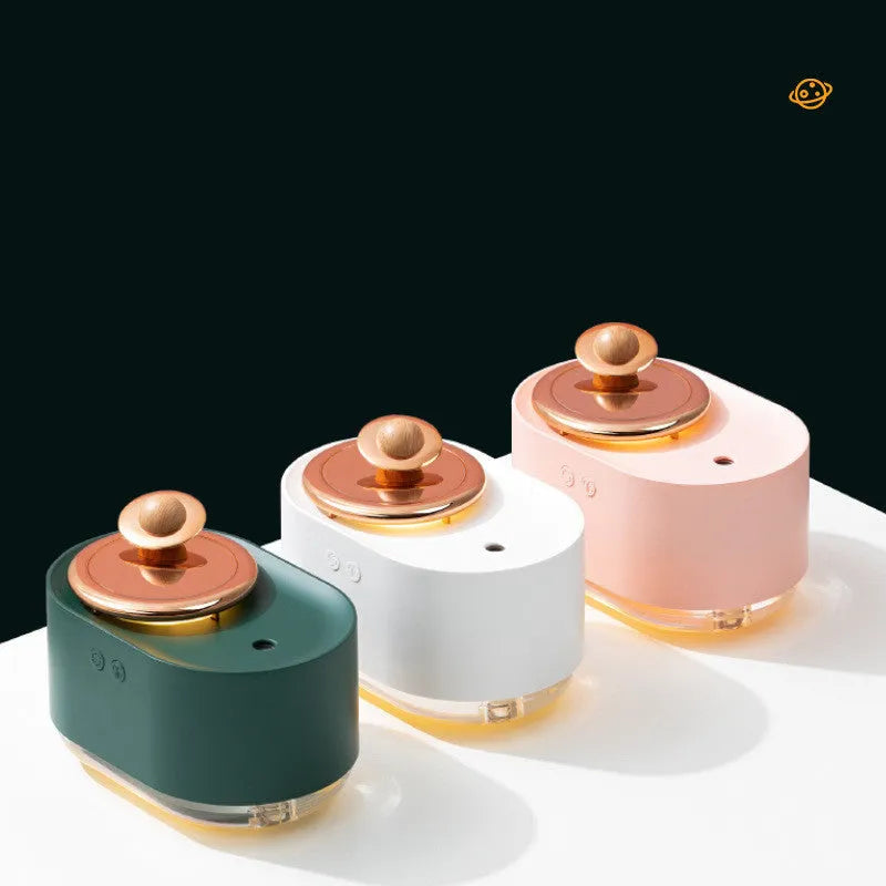 Green rotating planet-shaped USB humidifier with night light on a wooden surface