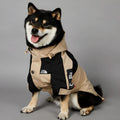 Khaki coloured polyester dog shell jacket shown on a model dog.