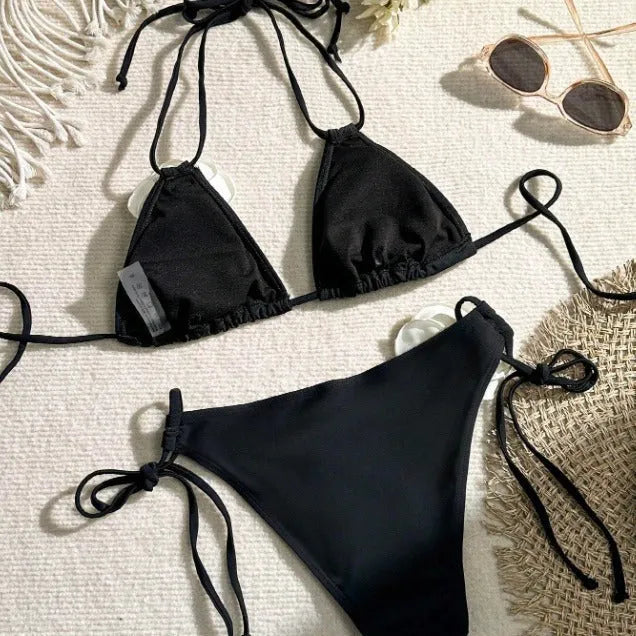 Black women's bikini swimsuit with 3D flower lace detailing and backless split design