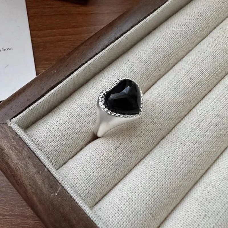 Adjustable S925 sterling silver ring with black agate heart design