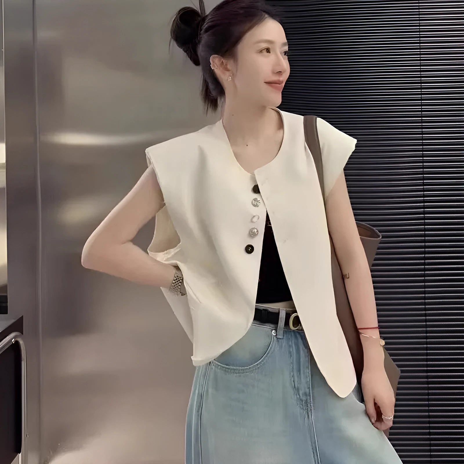 Women's short length polyester vest in milky white with front pockets