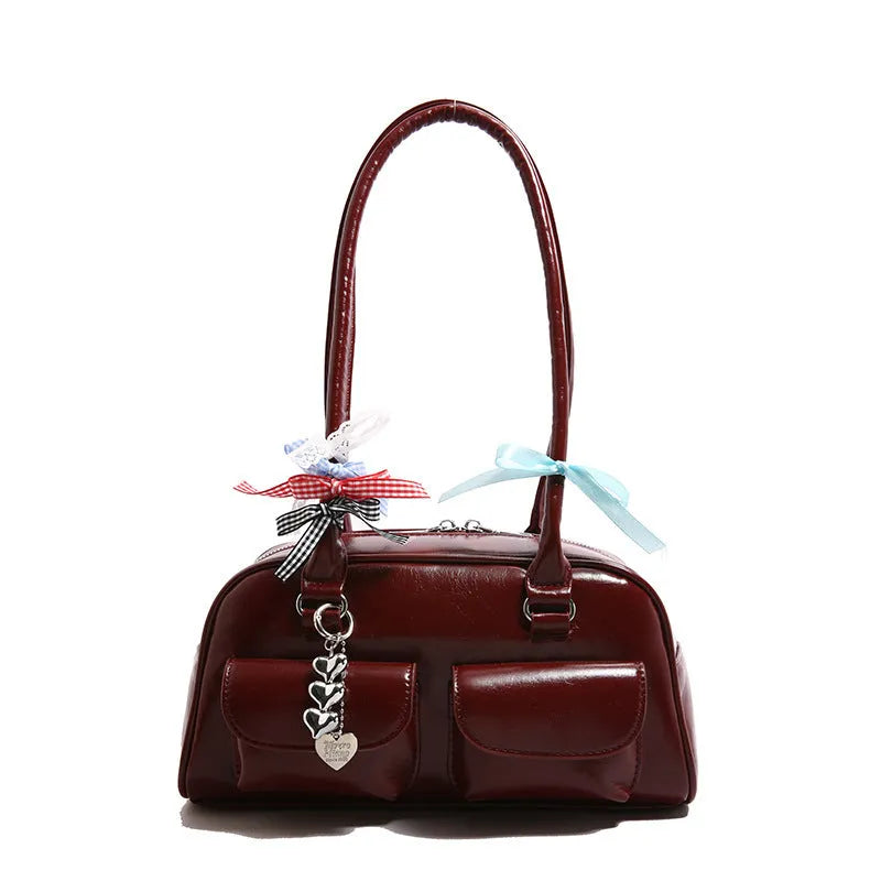 Women's brown PU leather retro pillow handbag with flap and ribbon pendant carried on shoulder
