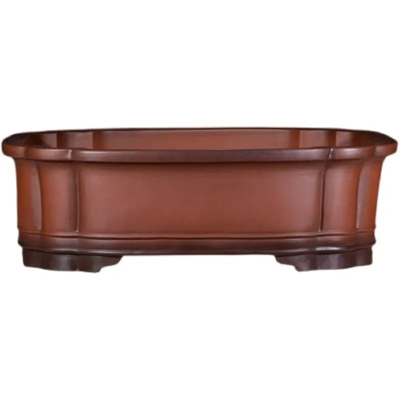 Large antique finish purple clay flower pot with Chinese tree stump design showing pine cypress pomegranate motifs