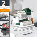 White double-layer kitchen storage rack with removable draining base showing utensil organisation