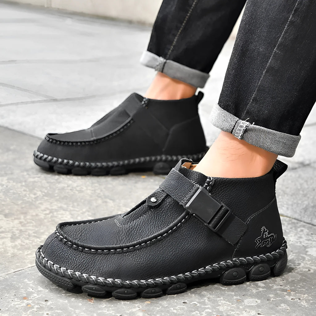 Men's black casual slip on shoes with handmade stitching and flat soles