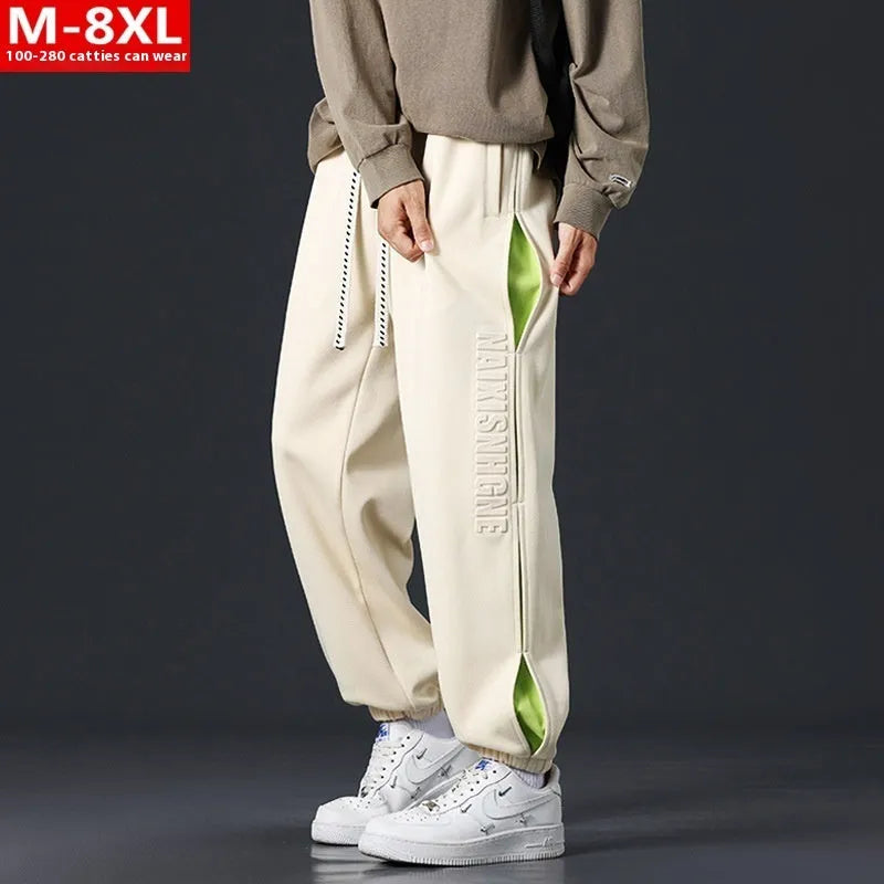 Men's loose cotton trousers with elasticated ankle bands and collage stitching details in khaki colour
