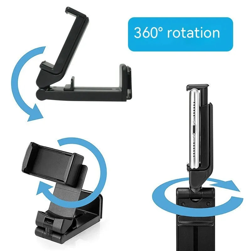 Black 360-degree rotating collapsible phone holder on desktop showing adjustable viewing angles