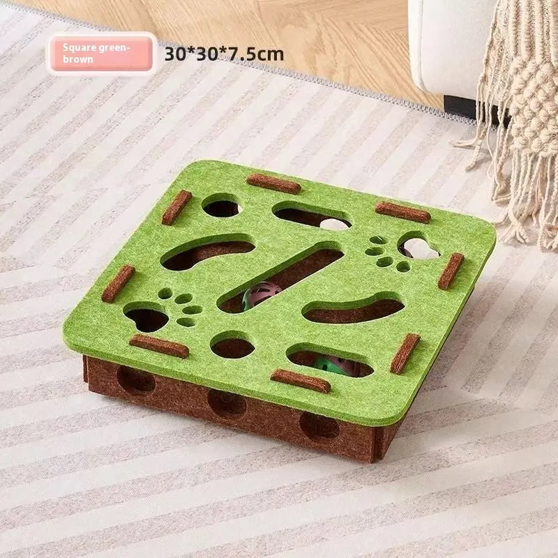 Green brown felt cube cat toy with holes for pet play and boredom relief.