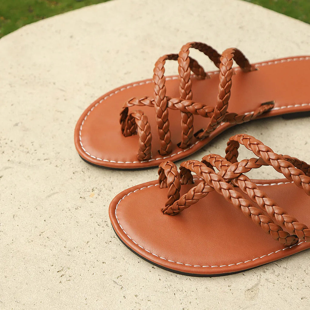 Women's clip-toe woven sandals showing Roman-style design with artificial PU upper and rubber sole