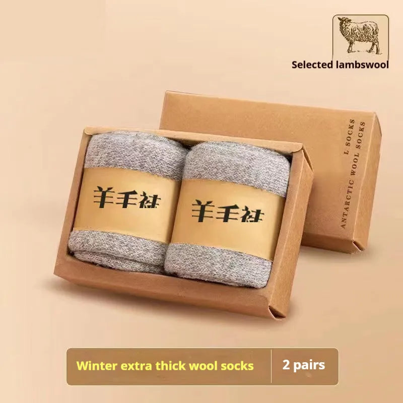 Pair of thick, solid-colour wool socks with a knitted texture, shown in a dark grey colour.