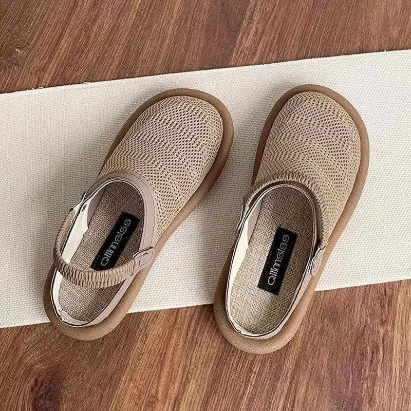 Milky white slip-on shoes with a hollow patterned linen upper and mesh lining, shown on a foot.