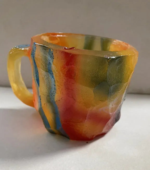 Purple resin mineral crystal coffee mug with handle showing 3D texture and 10cm height