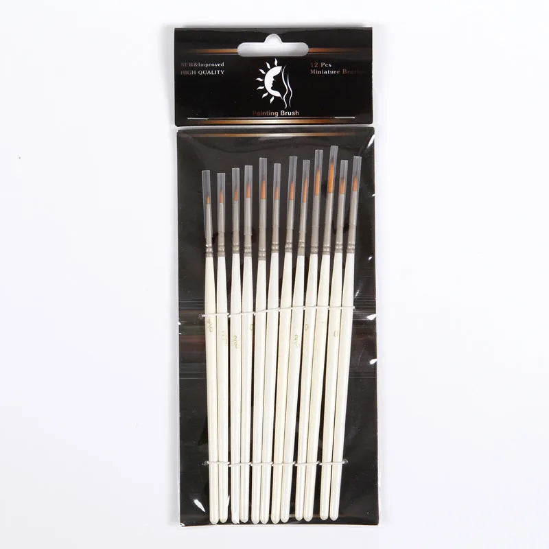 Set of 12 pearl white artist painting brushes with wooden handles and nylon wool fibres.