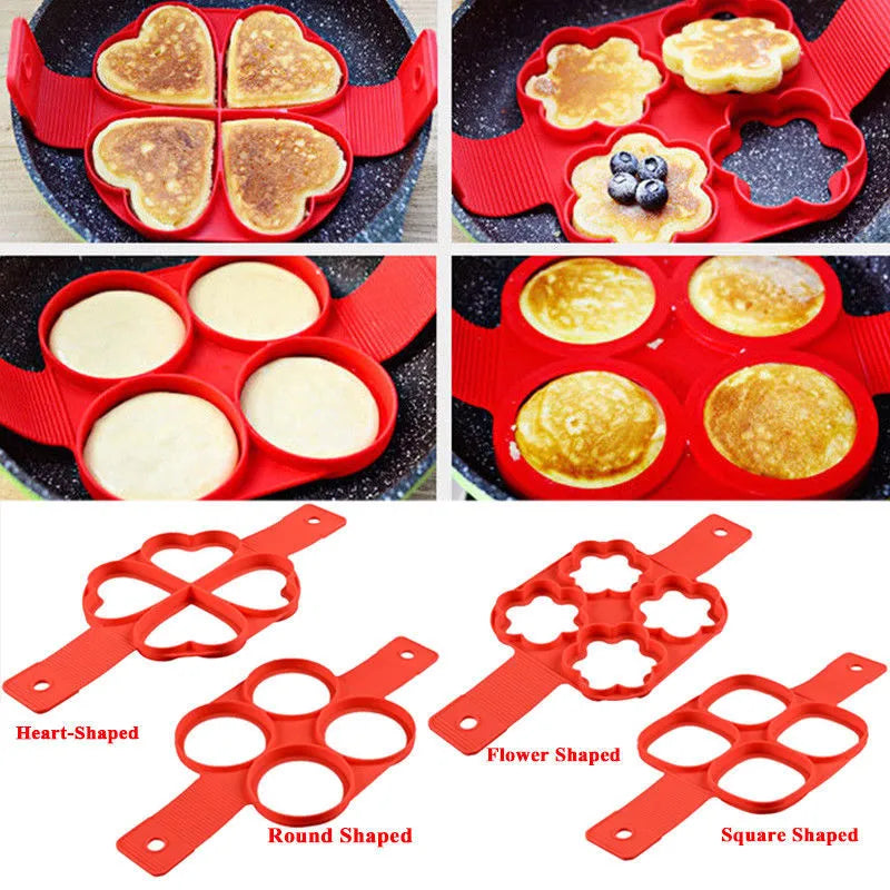 Red silicone non-stick egg ring mould for making round pancakes on a frying pan