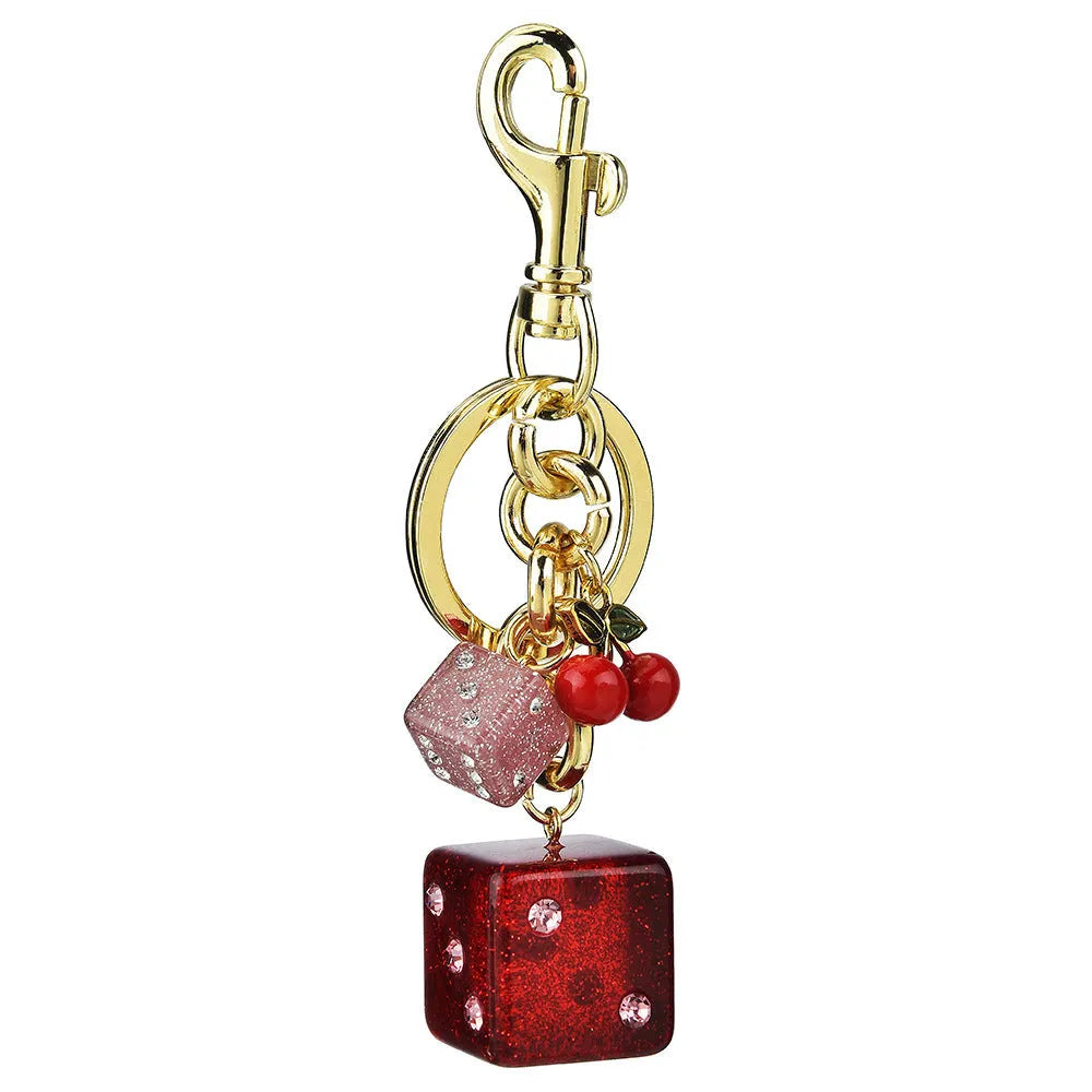 Square metal keychain pendant featuring a vintage cherry red and white two-tone dice pattern.