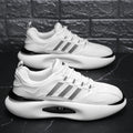 Men's mesh breathable running sneakers in white with green trim, rubber sole, front lacing, round toe