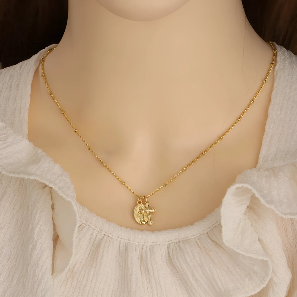 Virgin Mary cross necklace with geometric pendant in gold colour