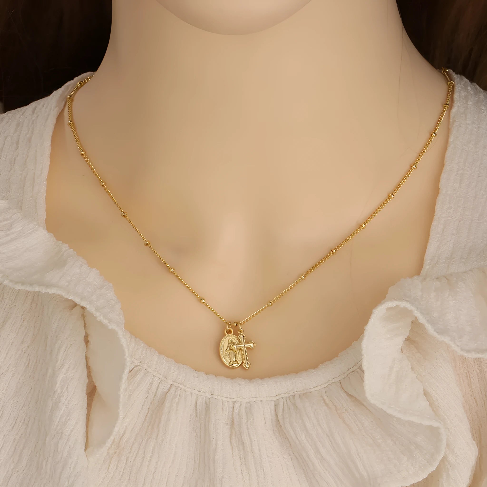 Virgin Mary cross necklace with geometric pendant in gold colour