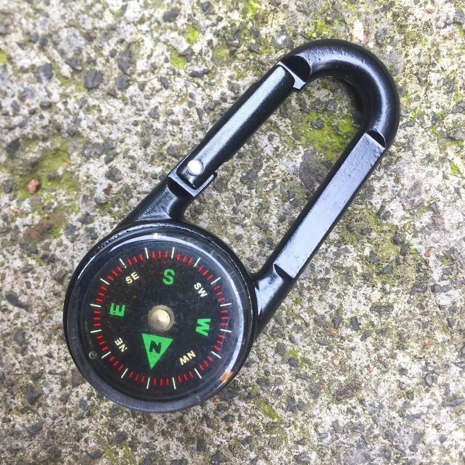 Black zinc alloy outdoor carabiner with integrated compass and thermometer display.