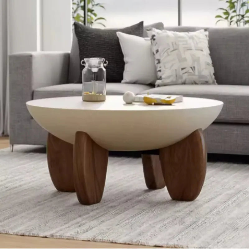 White solid wood adjustable height coffee table with storage, shown in a living room setting.