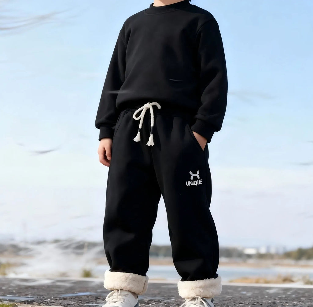Children's trousers in black and blue with drawstring waist and ribbed hem, sizes 22-26 for ages 3-7