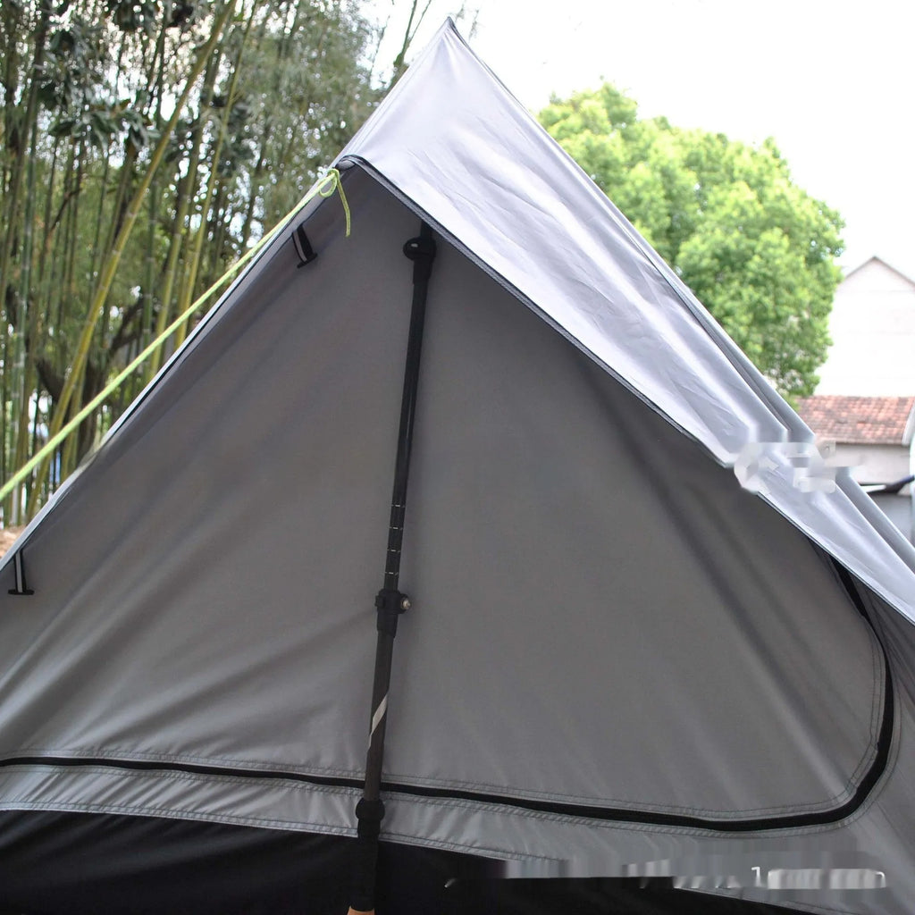 Brown A-line hiking tent erected with hiking poles showing spacious interior for 2-3 people