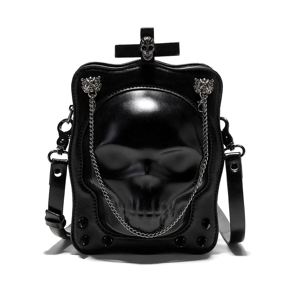 Black mini square messenger bag with a gothic embossed skull design, chain detail, and a crossbody strap.