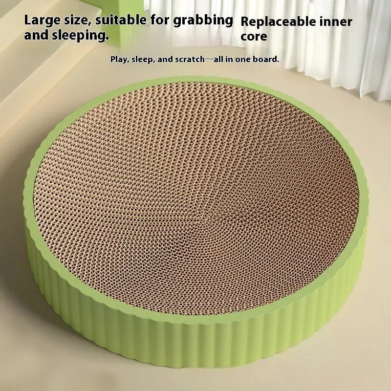 Round green and white corrugated paper cat scratching board and nest, 55cm diameter, with replacement refills.